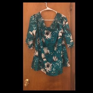 Teal floral “cold-shoulder” top
